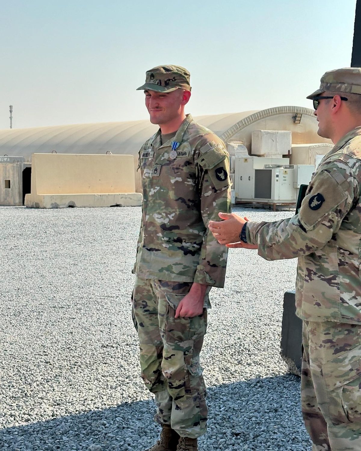 Dylan Moser in Army uniform during an award ceremony.